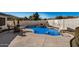 Inviting pool with rock features, seating area and basketball hoop at 3194 E Mead Dr, Chandler, AZ 85249