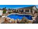 Backyard with a rock-rimmed pool, basketball hoop, and patio furniture, perfect for outdoor enjoyment at 3194 E Mead Dr, Chandler, AZ 85249