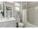 Bathroom with white cabinets, faucet, mirror with 'Hello Gorgeous' inscription, and shower at 3932 E Torrey Pines Ln, Chandler, AZ 85249