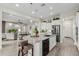 Open kitchen design featuring a granite island, stainless steel appliances, and a view into the living room at 3932 E Torrey Pines Ln, Chandler, AZ 85249