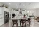 Spacious kitchen island with granite countertops, pendant lighting, and seating, perfect for entertaining at 3932 E Torrey Pines Ln, Chandler, AZ 85249