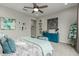 Well lit main bedroom with a modern ceiling fan and art at 3932 E Torrey Pines Ln, Chandler, AZ 85249