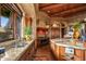 Spacious kitchen featuring granite countertops, stainless steel appliances, and custom wood cabinetry at 41731 N Stone Cutter Dr, Scottsdale, AZ 85262