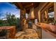 Outdoor kitchen with a built-in grill, countertop space, and stone accents, perfect for outdoor dining at 41731 N Stone Cutter Dr, Scottsdale, AZ 85262