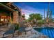 Relaxing poolside featuring comfortable lounge chairs, scenic views, and an outdoor sculpture, creating a tranquil retreat at 41731 N Stone Cutter Dr, Scottsdale, AZ 85262