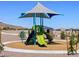 Exterior view of the neighborhood playground with slides, picnic tables, and shade structure at 4324 W Jeanette Ln, San Tan Valley, AZ 85144