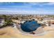 Aerial view of a community pond with gazebos, walking paths, and landscaping, surrounded by houses at 5139 S Bridal Vail Dr, Gilbert, AZ 85298