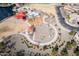 Aerial view of a community park featuring a basketball court, playground, picnic area, and walking trails at 5139 S Bridal Vail Dr, Gilbert, AZ 85298