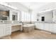 Bathroom featuring a tiled tub, wooden floors, chandelier, and double mirrors at 5139 S Bridal Vail Dr, Gilbert, AZ 85298