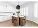 Cozy dining area with round table, stylish chairs, and modern chandelier at 5139 S Bridal Vail Dr, Gilbert, AZ 85298