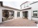 Covered front entrance with paver patio, fireplace and seating area at 5139 S Bridal Vail Dr, Gilbert, AZ 85298