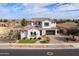 Charming two-story home with a well-manicured lawn, desert landscaping, and a tile roof at 5139 S Bridal Vail Dr, Gilbert, AZ 85298