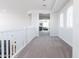 White hallway featuring carpeted floors and leading to a Gathering room at 5139 S Bridal Vail Dr, Gilbert, AZ 85298