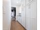 Hallway with white cabinets, granite countertops, and a view into a sitting area at 5139 S Bridal Vail Dr, Gilbert, AZ 85298