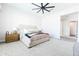 Bright main bedroom featuring a large carpet, ceiling fan, and neutral colors at 5139 S Bridal Vail Dr, Gilbert, AZ 85298