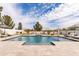 Backyard swimming pool offers in-water seating, built-in lighting, and ample space for sunbathing or entertaining at 5139 S Bridal Vail Dr, Gilbert, AZ 85298