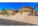 Inviting single-story home showcasing desert landscaping and a convenient two-car garage at 5161 N Scottsdale Rd, Eloy, AZ 85131