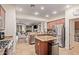 Modern kitchen featuring granite countertops, stainless steel appliances, and a center island at 5161 N Scottsdale Rd, Eloy, AZ 85131