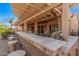 Spacious outdoor kitchen includes a built-in grill and sink, perfect for entertaining at 5161 N Scottsdale Rd, Eloy, AZ 85131