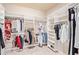 Organized walk-in closet with ample shelving and hanging space for clothes and accessories at 5161 N Scottsdale Rd, Eloy, AZ 85131