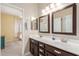 Bathroom with double sink vanity and entrance to bedroom at 5356 W Jupiter Way, Chandler, AZ 85226