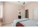 A bedroom featuring an ensuite bathroom, neutral paint, and carpeted floors at 5356 W Jupiter Way, Chandler, AZ 85226