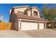 Exterior view of home featuring a three car garage, desert landscaping, and tile roof at 5356 W Jupiter Way, Chandler, AZ 85226