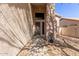 Exterior shot of a property's entrance showing a secure front door with a desert landscape at 5356 W Jupiter Way, Chandler, AZ 85226