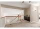 Neutral hallway featuring carpeted floors, wood railings and built-in cabinets at 5356 W Jupiter Way, Chandler, AZ 85226