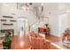 Bright living room featuring soaring ceilings, hardwood floors, staircase, and neutral paint at 5356 W Jupiter Way, Chandler, AZ 85226