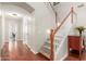 Staircase featuring wood banister, hardwood floors and neutral paint at 5356 W Jupiter Way, Chandler, AZ 85226