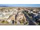 Aerial view of a desert neighborhood showcasing a well-maintained home with mature landscaping at 5539 S Verde --, Mesa, AZ 85212