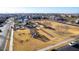 An aerial view of a neighborhood park with playground equipment and green spaces for recreation at 5539 S Verde --, Mesa, AZ 85212