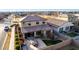 Aerial view of a private backyard featuring a patio with a dining area and manicured green spaces at 5539 S Verde --, Mesa, AZ 85212