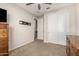 Bedroom with neutral paint, carpet, and vintage wood furniture and closet with white doors at 5539 S Verde --, Mesa, AZ 85212