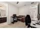 Bedroom featuring neutral paint, carpet, ceiling fan, and crib used as a home office at 5539 S Verde --, Mesa, AZ 85212