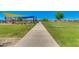 Scenic walking path by a large green space, connecting homes and recreational areas for an active lifestyle at 5539 S Verde --, Mesa, AZ 85212