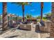 Outdoor fire pit area with built-in seating, creating a cozy gathering space for residents at 5539 S Verde --, Mesa, AZ 85212