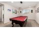 Spacious game room features a red felt pool table with modern lighting and neutral walls at 5539 S Verde --, Mesa, AZ 85212