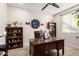 Charming home office with wood desk, built in shelving, and plenty of natural light at 5539 S Verde --, Mesa, AZ 85212