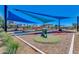 Shaded playground area equipped with modern play structures for enjoyment and outdoor fun at 5539 S Verde --, Mesa, AZ 85212