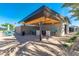 The outdoor kitchen area offers a spacious counter, bar seating, and shaded dining area by the pool at 5539 S Verde --, Mesa, AZ 85212