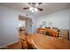 Dining room with wooden table and chairs open to the living area at 592 Leisure World --, Mesa, AZ 85206