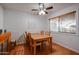 Dining room featuring wood floors, a ceiling fan, and natural light at 592 Leisure World --, Mesa, AZ 85206