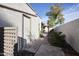 Exterior view with storage and covered patio beyond the gate at 592 Leisure World --, Mesa, AZ 85206