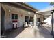 An outdoor patio featuring tables, seating, lighting, and a red grill at 592 Leisure World --, Mesa, AZ 85206