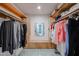 Walk-in closet with custom wood shelving and storage at 592 Leisure World --, Mesa, AZ 85206