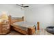 Comfortable bedroom features wooden bed frame and wood laminate flooring at 6009 N 79Th St, Scottsdale, AZ 85250