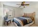 Cozy bedroom showcases classic furnishings and large window with plenty of natural light at 6009 N 79Th St, Scottsdale, AZ 85250