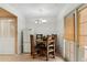 The dining room has casual wood furniture, an overhead light, neutral walls, and access to the back patio at 6009 N 79Th St, Scottsdale, AZ 85250